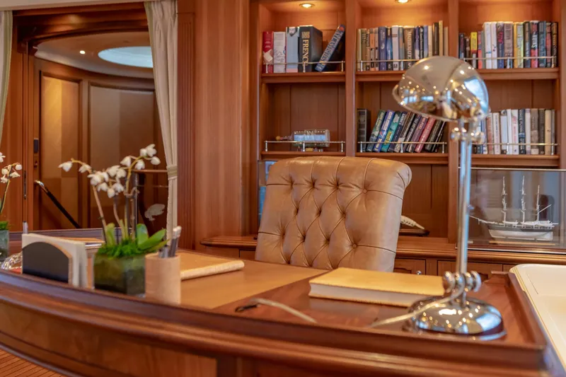 Slide: The Image of Luxurious yacht office with leather chair, bookshelves, and elegant decor, aboard a 2010 Burger Custom. - 44