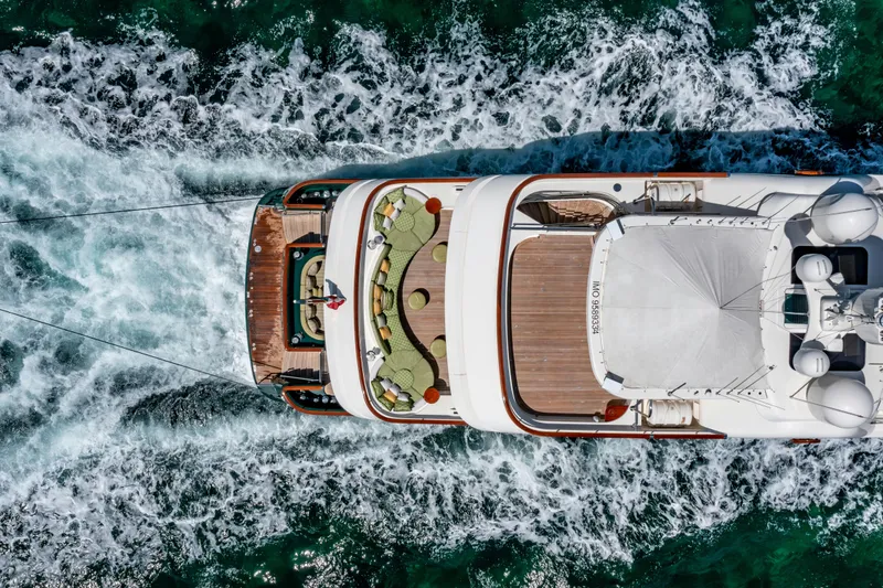 Slide: The Image of Aerial view of 2010 Burger Custom yacht cruising through ocean waves. - 48