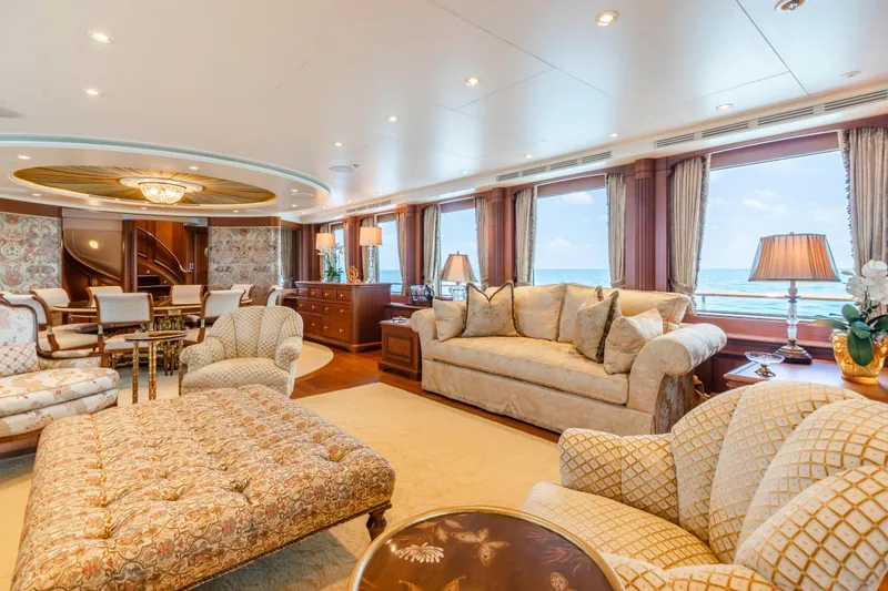 Slide: The Image of Luxurious yacht interior with elegant furnishings, large windows, and ocean view. Burger Custom 2010 model. - 5