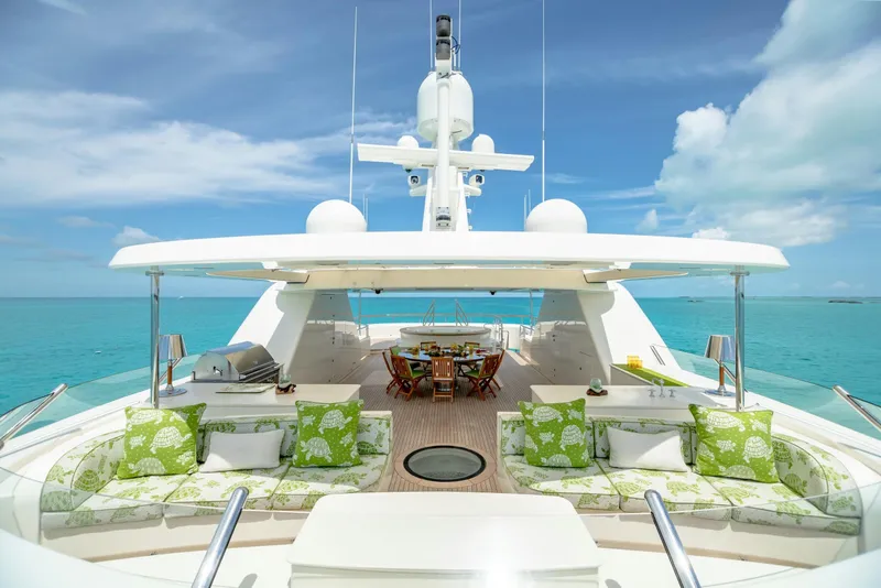 Slide: The Image of Luxurious 2010 Burger Custom yacht deck with seating, dining area, and ocean view. - 53