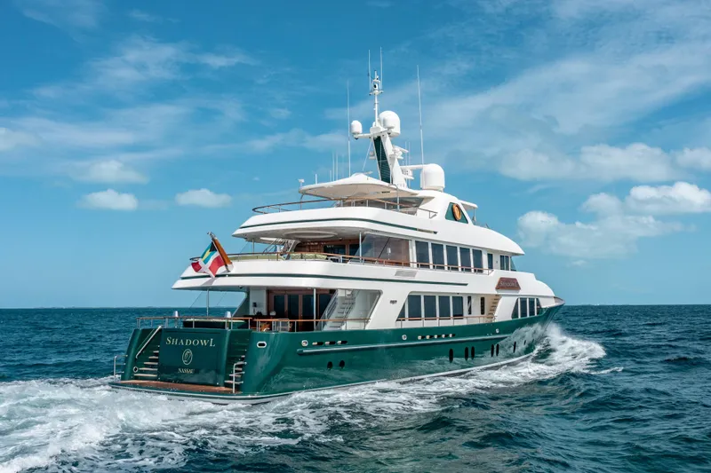 Slide: The Image of Luxurious 2010 Burger Custom yacht cruising on open sea under clear blue sky. - 58
