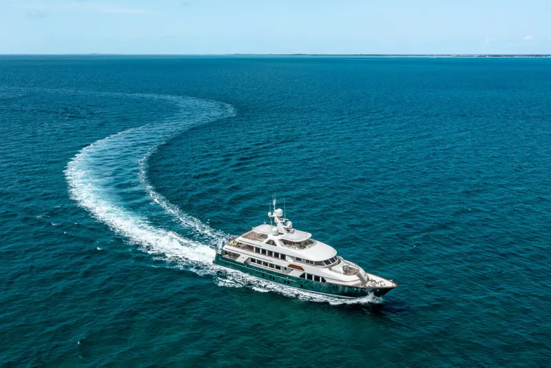 Slide: The Image of Luxurious 2010 Burger Custom yacht cruising on open blue ocean waters. - 59