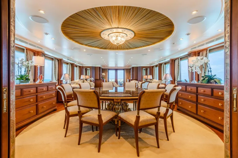 Slide: The Image of Luxurious yacht interior with elegant dining area, custom woodwork, and panoramic windows, 2010 Burger model. - 9