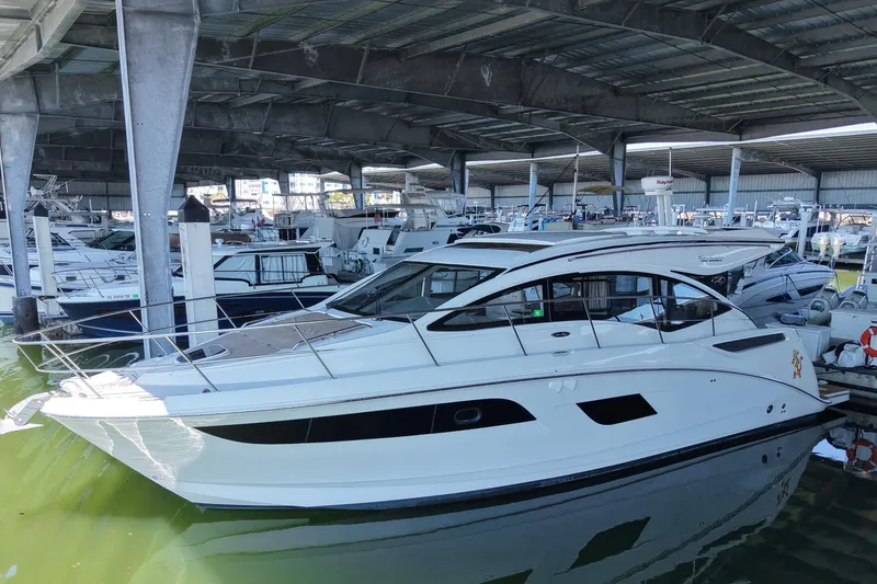 Slide: The Image of 2017 Sea Ray Sundancer 400 yacht docked in a covered marina. - 0
