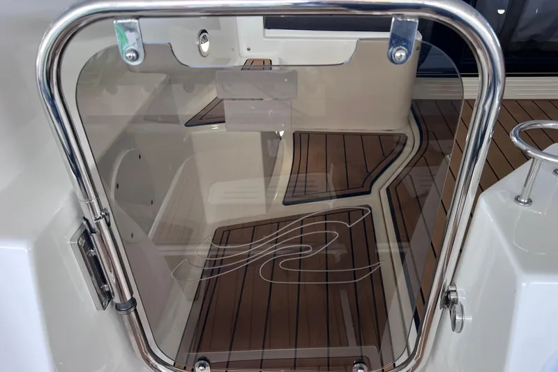Slide: The Image of 2017 Sea Ray Sundancer 400 yacht with sleek glass door and teak flooring. - 18