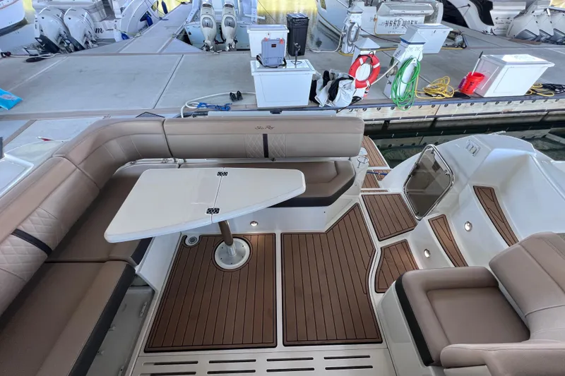 Slide: The Image of 2017 Sea Ray Sundancer 400 yacht interior with elegant seating and table setup. - 36