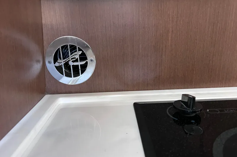 Slide: The Image of Vent and stove knob in 2017 Sea Ray Sundancer 400 yacht kitchen. - 39