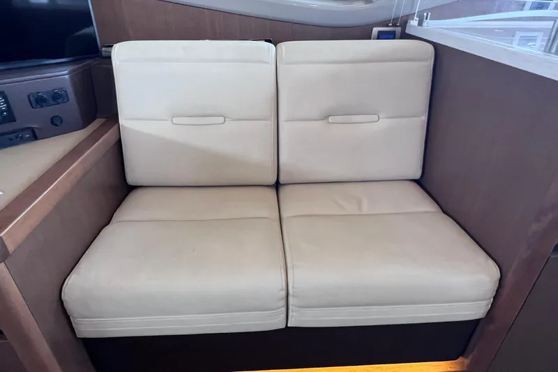 Slide: The Image of Beige seating in 2017 Sea Ray Sundancer 400 yacht interior. - 43