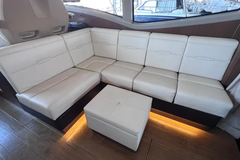 Slide: The Image of Luxurious white leather seating in 2017 Sea Ray Sundancer 400 yacht interior. - 47