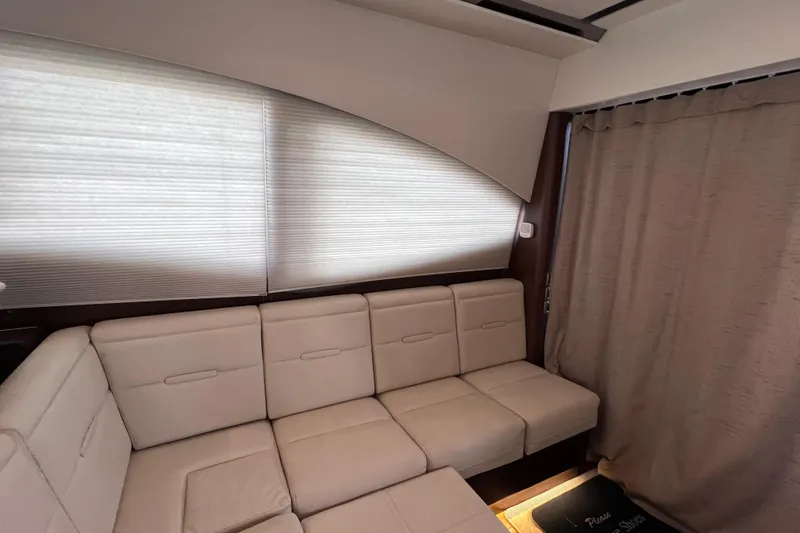 Slide: The Image of Interior of 2017 Sea Ray Sundancer 400 yacht with beige leather seating. - 48