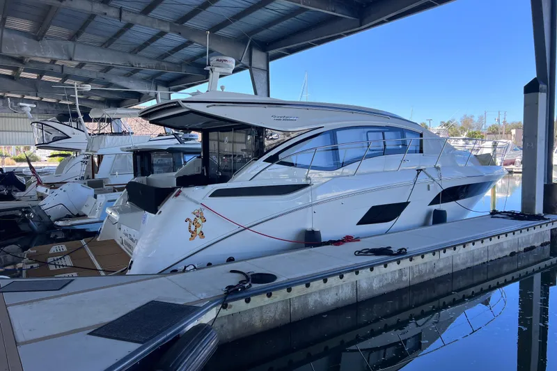 Slide: The Image of 2017 Sea Ray Sundancer 400 yacht docked in a marina under a covered structure. - 5