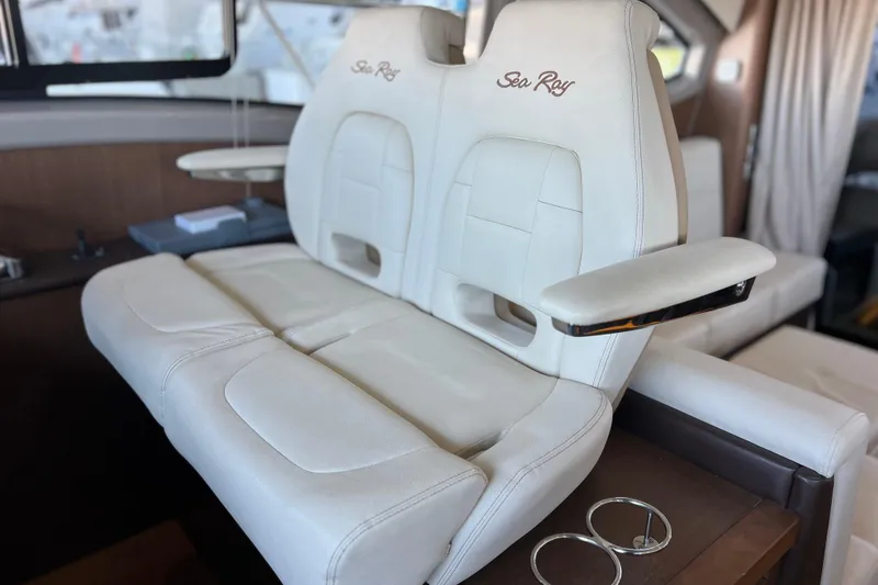 Slide: The Image of Luxurious white seating in 2017 Sea Ray Sundancer 400 yacht interior. - 52