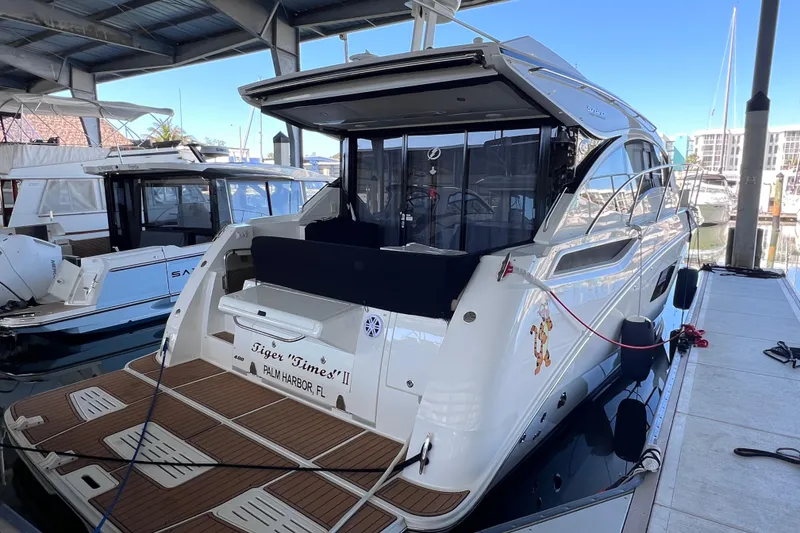 Slide: The Image of 2017 Sea Ray Sundancer 400 yacht docked at marina, rear view. - 6