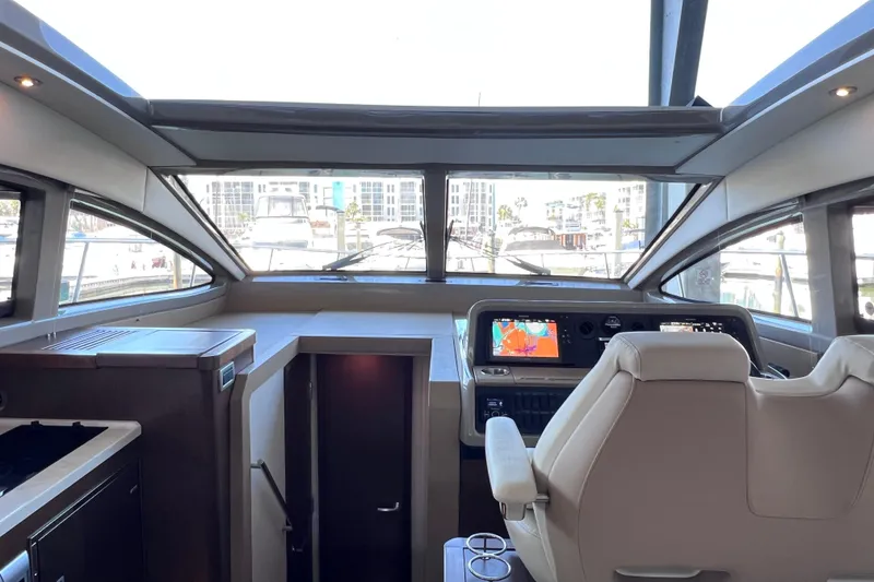 Slide: The Image of Interior view of 2017 Sea Ray Sundancer 400 yacht cockpit with navigation screens. - 61