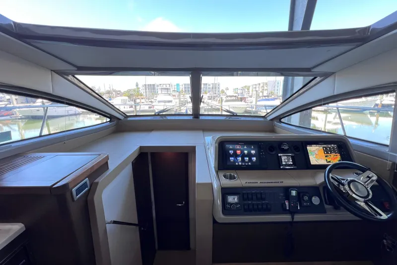 Slide: The Image of Interior helm of 2017 Sea Ray Sundancer 400 yacht with modern navigation controls. - 63
