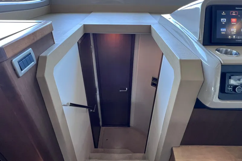 Slide: The Image of Interior stairs of 2017 Sea Ray Sundancer 400 yacht, featuring modern design and control panel. - 65