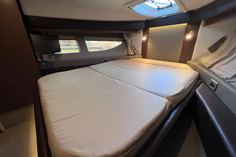 Slide: The Image of Luxurious 2017 Sea Ray Sundancer 400 cabin with spacious bed and modern amenities. - 72