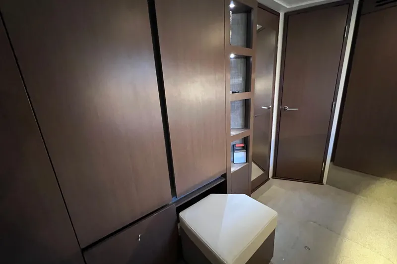 Slide: The Image of 2017 Sea Ray Sundancer 400 interior with wooden cabinets and seating. - 75