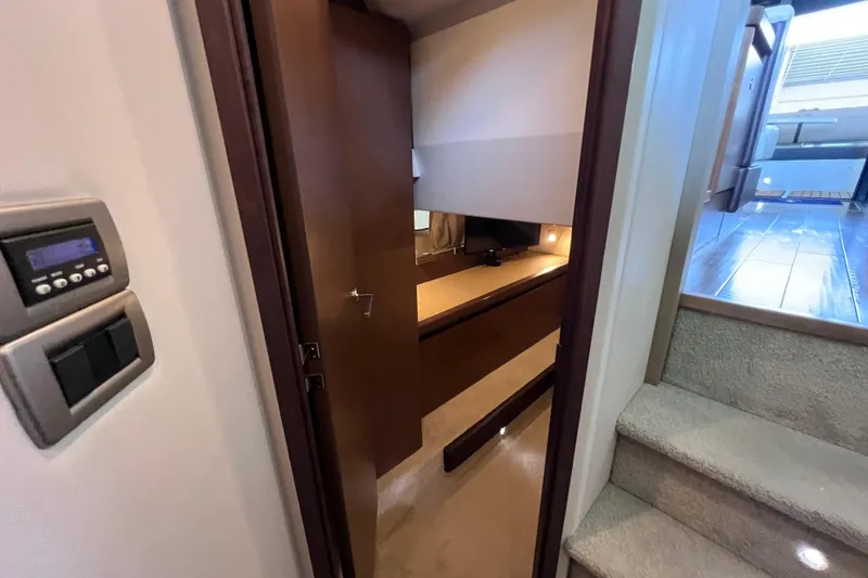 Slide: The Image of Interior of 2017 Sea Ray Sundancer 400 yacht, featuring a cozy cabin and modern controls. - 77