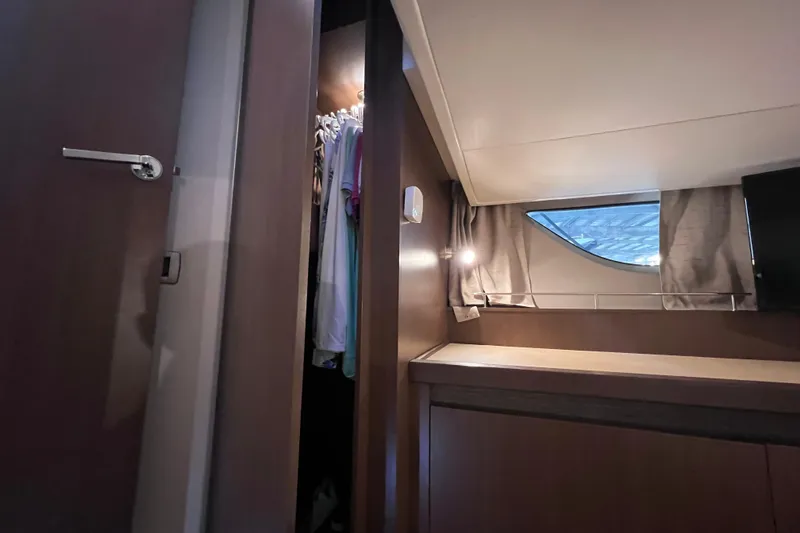 Slide: The Image of Interior of 2017 Sea Ray Sundancer 400 yacht with closet and window view. - 81