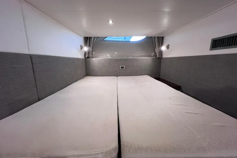 Slide: The Image of 2017 Sea Ray Sundancer 400 cabin interior with twin beds and modern design. - 82