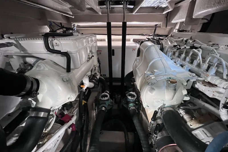 Slide: The Image of Engine room of 2017 Sea Ray Sundancer 400 yacht, showcasing dual engines and mechanical components. - 89