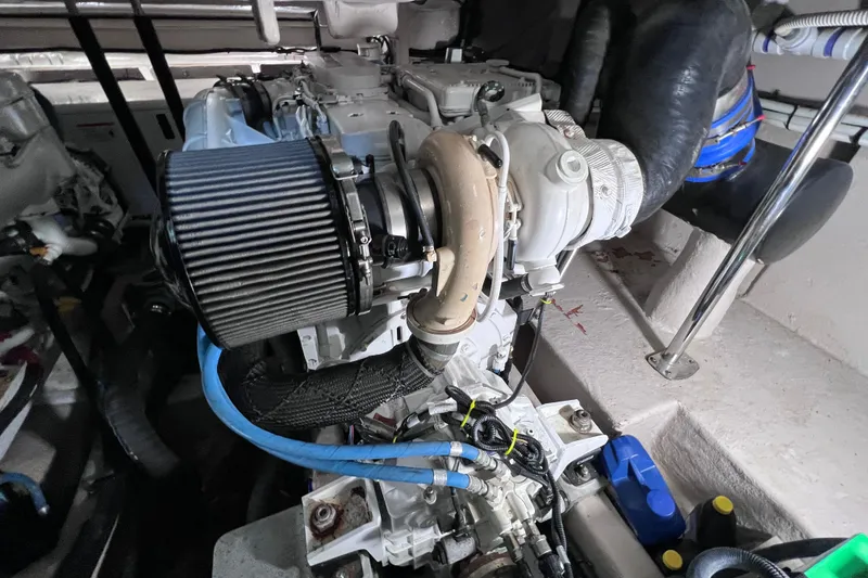 Slide: The Image of Engine compartment of 2017 Sea Ray Sundancer 400, showcasing detailed mechanical components. - 90