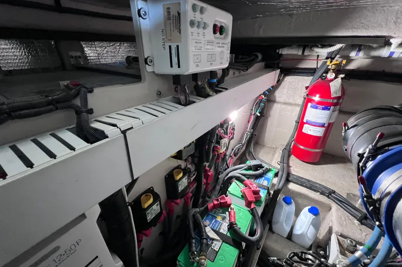 Slide: The Image of Engine room of 2017 Sea Ray Sundancer 400 with batteries and fire extinguisher. - 92