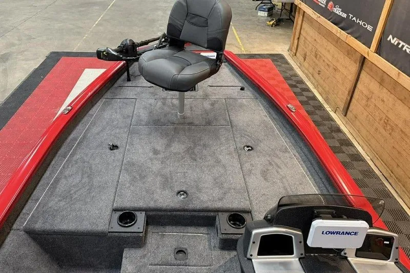 Slide: The Image of 2026 Tracker Pro Team 190 boat interior with fishing seat and Lowrance equipment. - 6