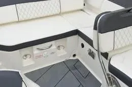 Slide: The Image of 2022 Bayliner DX 2250 boat interior with white and black seating. - 6