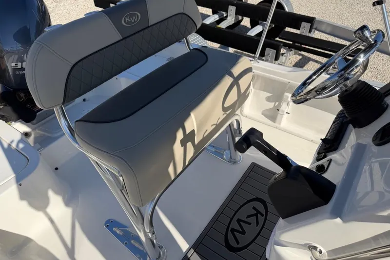 Slide: The Image of 2026 Key West 1720 Center Console boat interior with steering wheel and seating. - 14