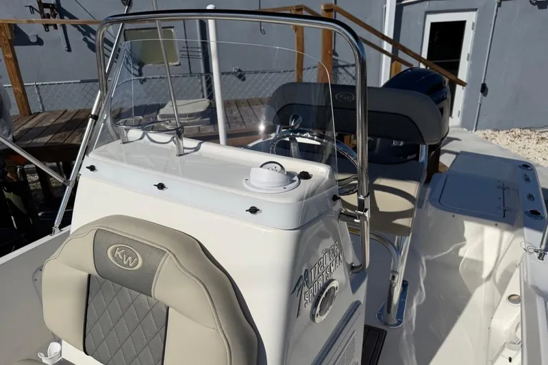 Slide: The Image of 2026 Key West 1720 Center Console boat interior with steering wheel and seating. - 17