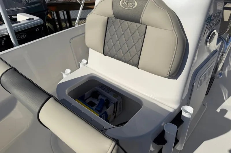 Slide: The Image of 2026 Key West 1720 Center Console boat seat with storage compartment open. - 19
