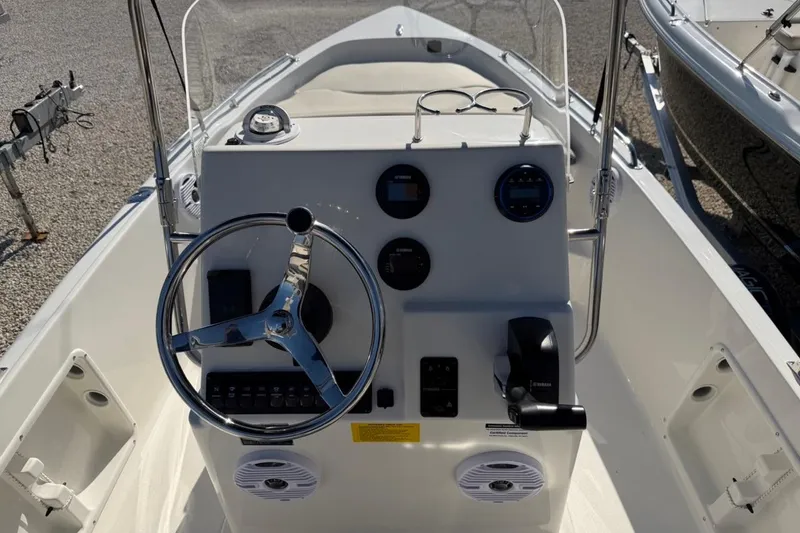 Slide: The Image of 2026 Key West 1720 Center Console boat interior with steering wheel and control panel. - 20