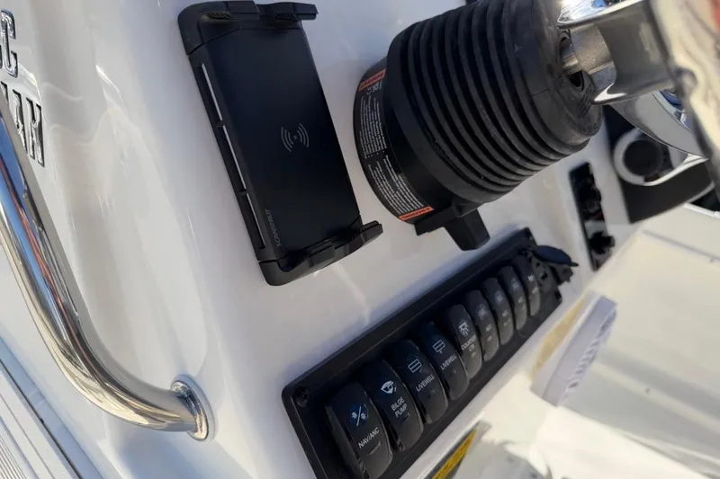 Slide: The Image of 2026 Key West 1720 Center Console dashboard with controls and wireless charging pad. - 22