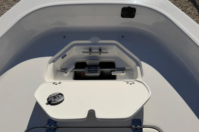 Slide: The Image of 2026 Key West 1720 Center Console boat storage compartment with open hatch. - 23