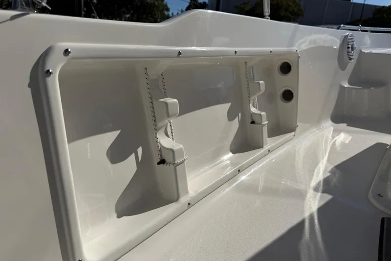 Slide: The Image of 2026 Key West 1720 Center Console boat interior detail with rod holders and cup holders. - 25