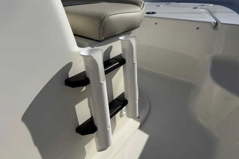 Slide: The Image of 2026 Key West 1720 Center Console boat interior with rod holders and seating. - 27