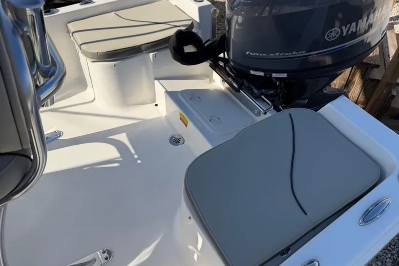 Slide: The Image of 2026 Key West 1720 Center Console boat interior with Yamaha engine and cushioned seating. - 7