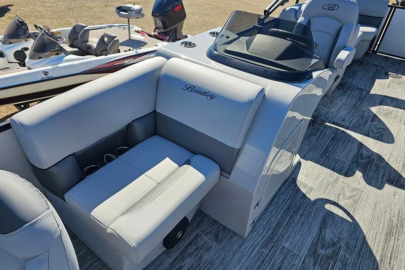 Slide: The Image of 2026 Bentley Pontoons 243 Fish CWT interior with plush seating and modern console. - 13
