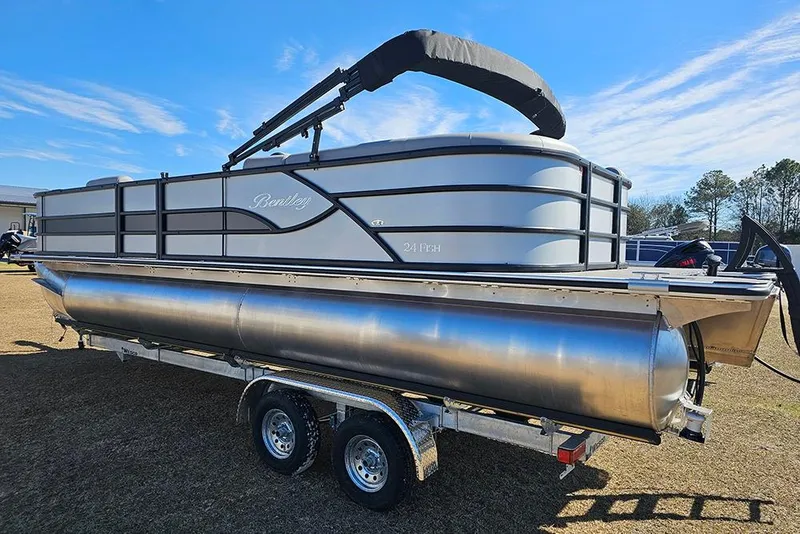 Slide: The Image of 2026 Bentley Pontoons 243 Fish CWT on trailer under clear blue sky. - 3
