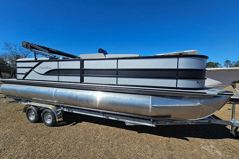 Slide: The Image of 2026 Bentley Pontoons 243 Fish CWT on trailer under clear blue sky. - 6