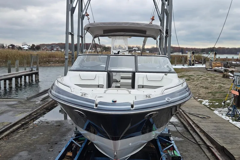 Slide: The Image of 2022 Formula 270 Bowrider boat on a dock, ready for launch. - 10