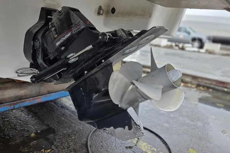 Slide: The Image of 2022 Formula 270 Bowrider boat with MerCruiser outdrive and propeller detail. - 15