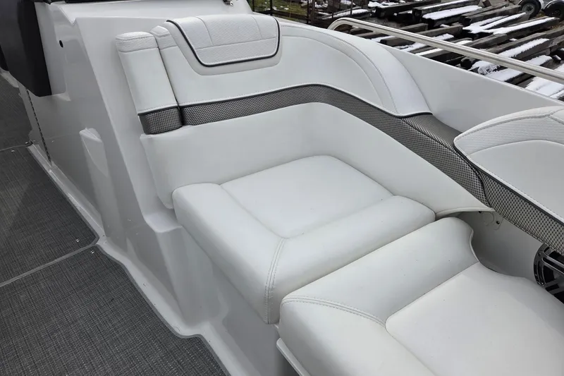 Slide: The Image of 2022 Formula 270 Bowrider interior seating with white upholstery and sleek design. - 18