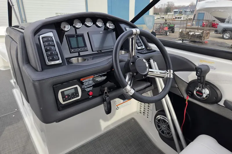 Slide: The Image of 2022 Formula 270 Bowrider dashboard with steering wheel, controls, and gauges. - 21