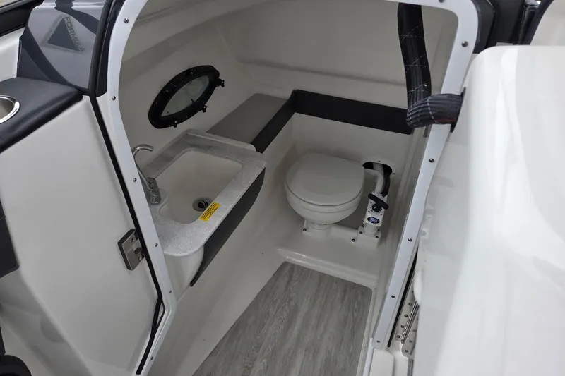 Slide: The Image of 2022 Formula 270 Bowrider interior with sink and toilet, featuring modern design. - 23