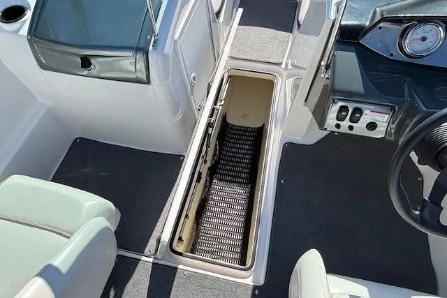 Slide: The Image of 2012 Yamaha SX190 boat interior with open storage compartment. - 11