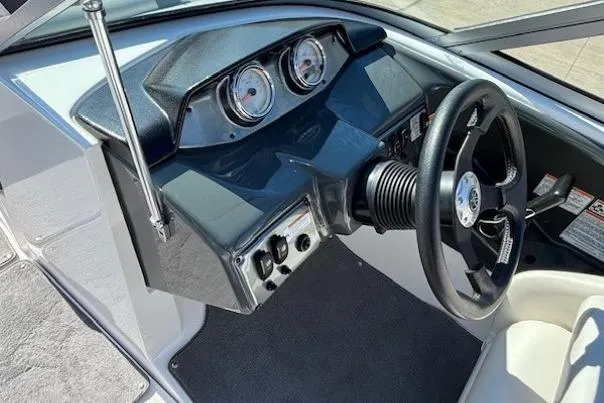 Slide: The Image of 2012 Yamaha Boats SX190 dashboard with steering wheel and gauges. - 12