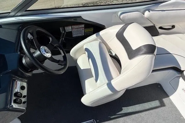 Slide: The Image of 2012 Yamaha Boats SX190 interior with steering wheel and white seating. - 15